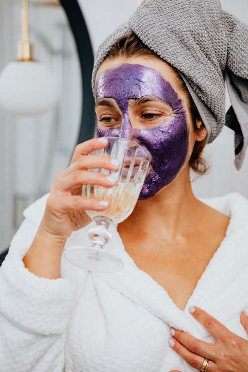 Skincare routine - Middle-Aged Woman in Bathroom