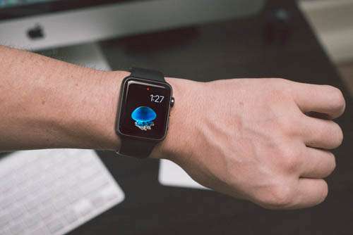 Apple Sport Watch Black On Mans Wrist In An Office