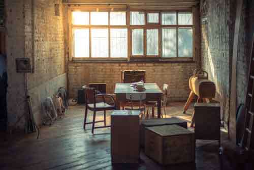 Retro Office Space With Books, Furniture And Sun Flare