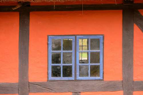 Orange Building With Blue Windows