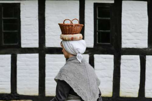 Woman Carrying a Basket on Her Head