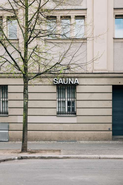 A Barred Window Holds A Sauna Sign Photo