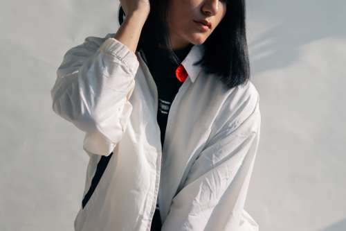 Young Woman Posing In White Jacket Photo