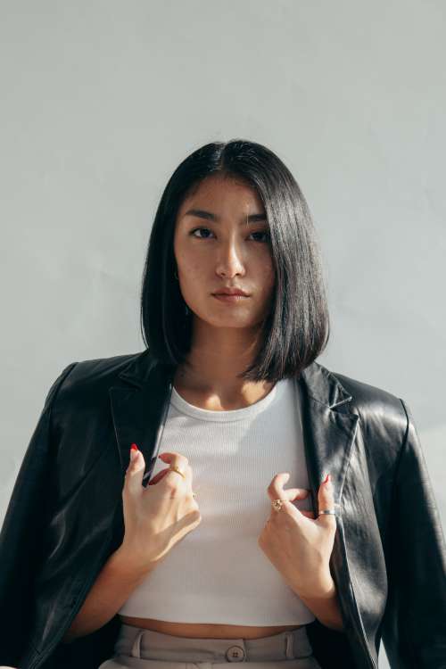 Model With Leather Jacket Over Shoulders Photo
