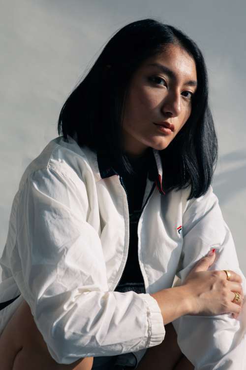 Close Up Woman Posing In White Casual Jacket Photo