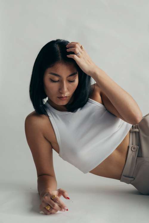 Woman In Cropped White Vest Top Photo