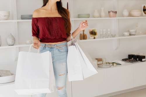 Young Woman With White Shopping Bags Photo