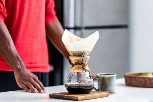 Man Waits For Pour Over Coffee To Brew Photo
