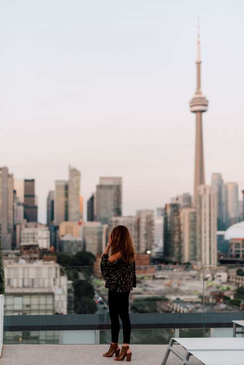 A Woman Looking Out At Toronto Photo
