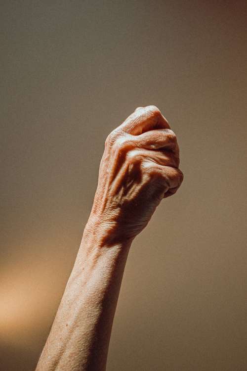Elderly Person Raises Their Fist Photo