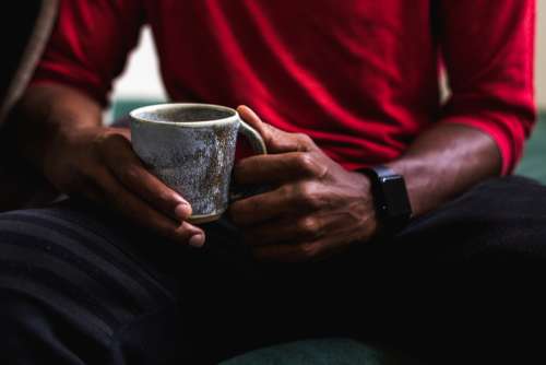 Close Up Man Holding Coffee Cup Photo