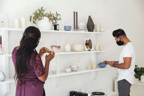 A Couple Looks At Home Goods Photo