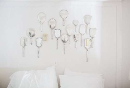 A Wall Of Hand Mirrors Photo