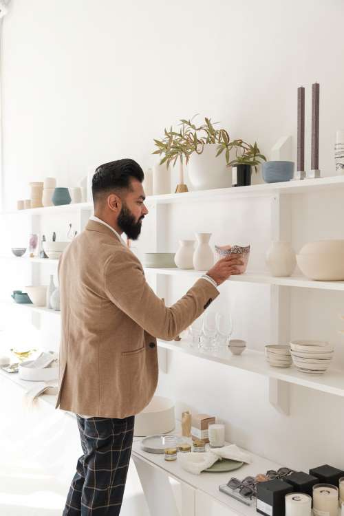Young Man Looks At Home Goods In Store Photo