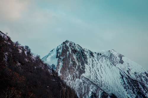 Snow Covered Mountains Above Winter Landscape Photo
