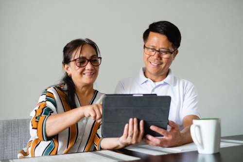 Couple Use A Tablet Together Photo