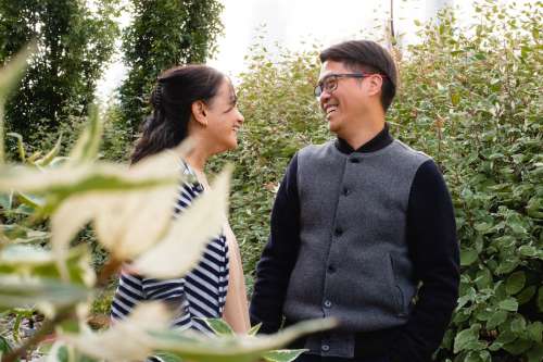 Couple Share A Laugh In A Garden Photo