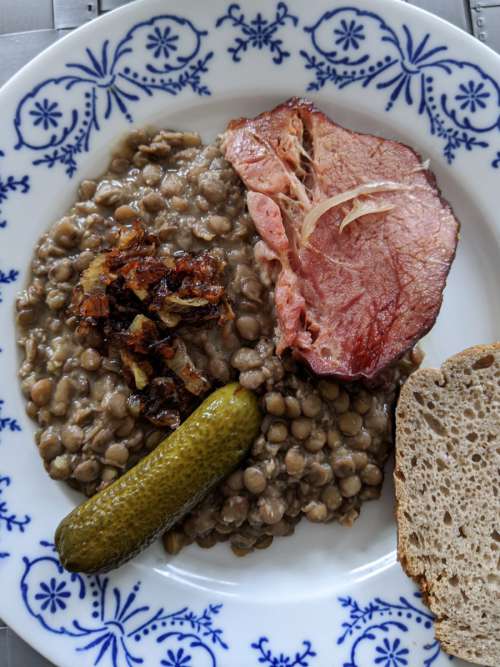 Traditional lentil stew with smoked pork meat