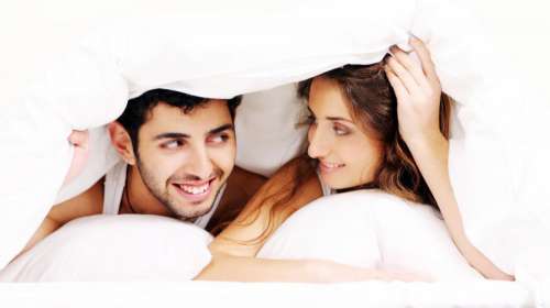 Young couple under the covers together