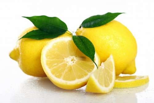 Fresh yellow lemons on white background
