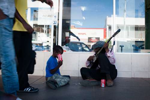 people, family, man, father, son, kid, boy, child, drinks, cola, guitar, instrument, music, homeless