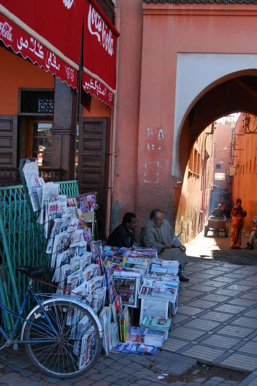 newspaper, bike, men, people, shelf, alley, street