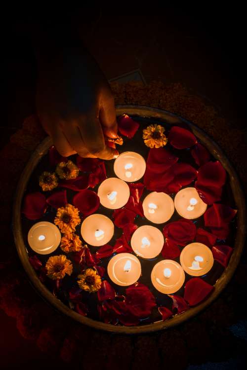 Tealights And Colorful Flowers In Dish Photo