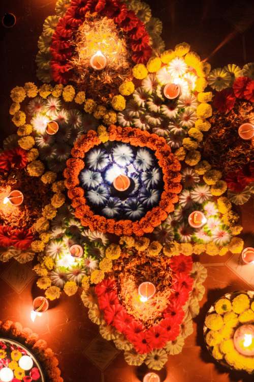 Colorful Rangoli Pattern With Candles Photo