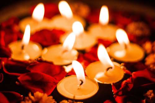 Close Up Of Candles And Petals Photo