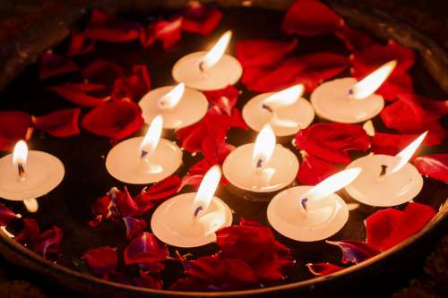 Tealights And Flower Petals Photo