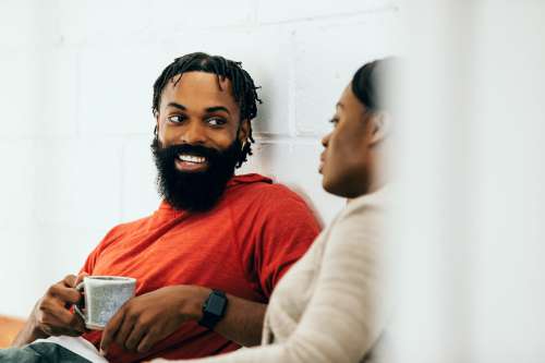 Smiling Man Holds Cup Of Tea Photo