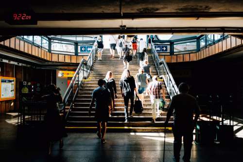 Illuminated Staircase In A Busy Station Photo