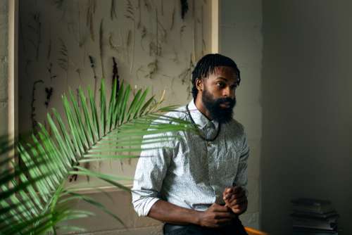 Portrait Of Man With Plant Photo