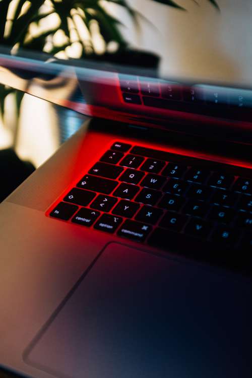 Laptop Keyboard In Red Hue Photo