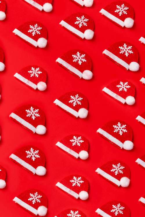 Flat Lay Of Felt Fabric Santa Hats Photo