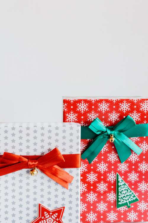 Two Colorful Wrapped Festive Gifts Photo