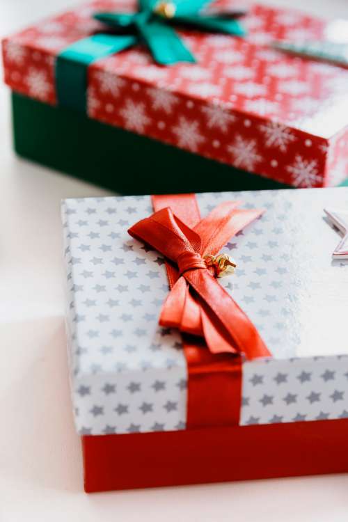 Gift Wrapped With Red And Green Bows Photo