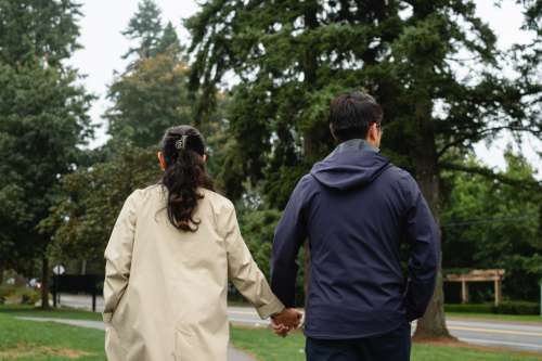 Man And Woman Holding Hands On A Relaxing Walk Photo