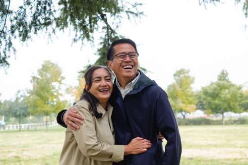 Man And Woman Hug And Laugh Photo