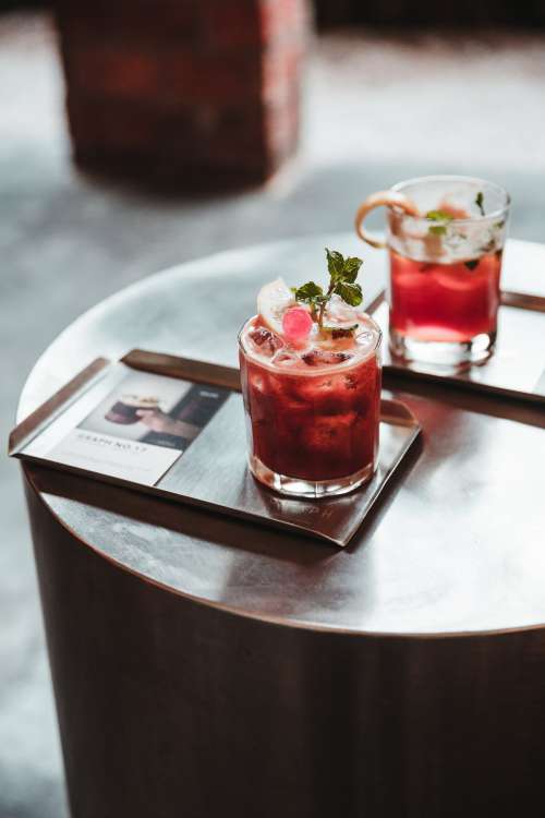 Two Red Cocktails On A Tray Photo