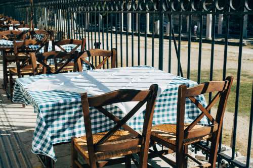 Green Gingham Table Cloth And Wooden Chairs Photo