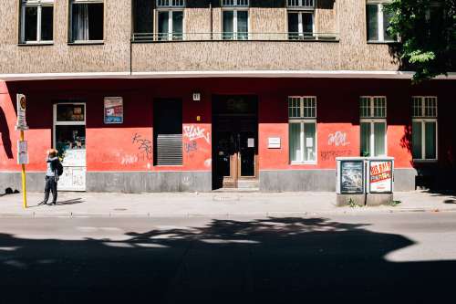 Red And Brown Building With Graffiti Photo