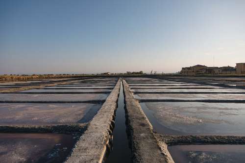 Cement Grid With Pools Of Water And Salt Photo