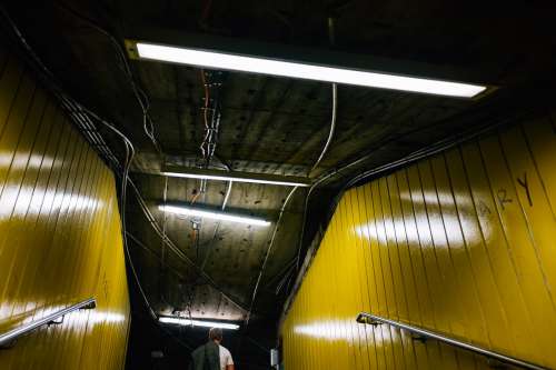 Looking Up At Yellow Walls In Subway Exit Photo