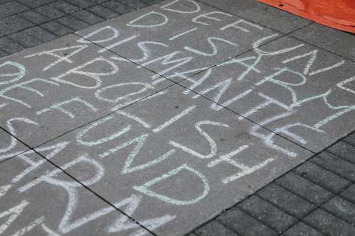 Chalk Words On Concrete During Protest Photo