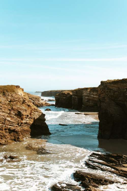 Cliffs Form Shadows By The Sea Photo