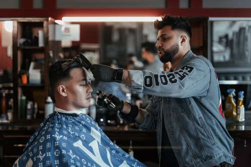 Barber Brushes And Cuts Hair Photo