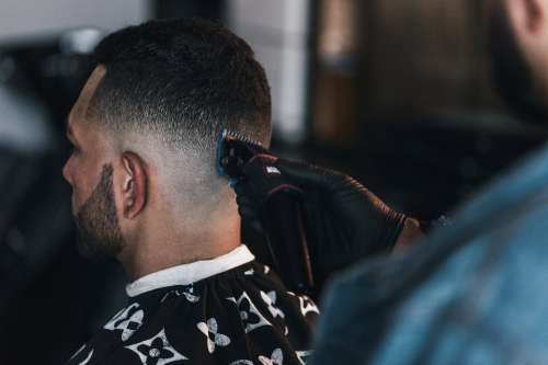 Close Up Of Barber Giving A Fade Photo