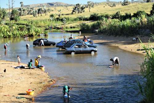 people, men, women, children, cars, river, drivers, forest, animals, laundry, car washes