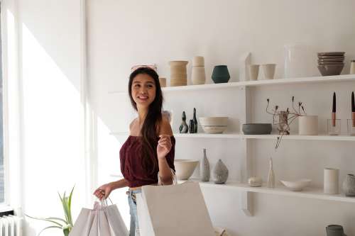 Woman With White Crisp Shopping Carrier Bags Photo